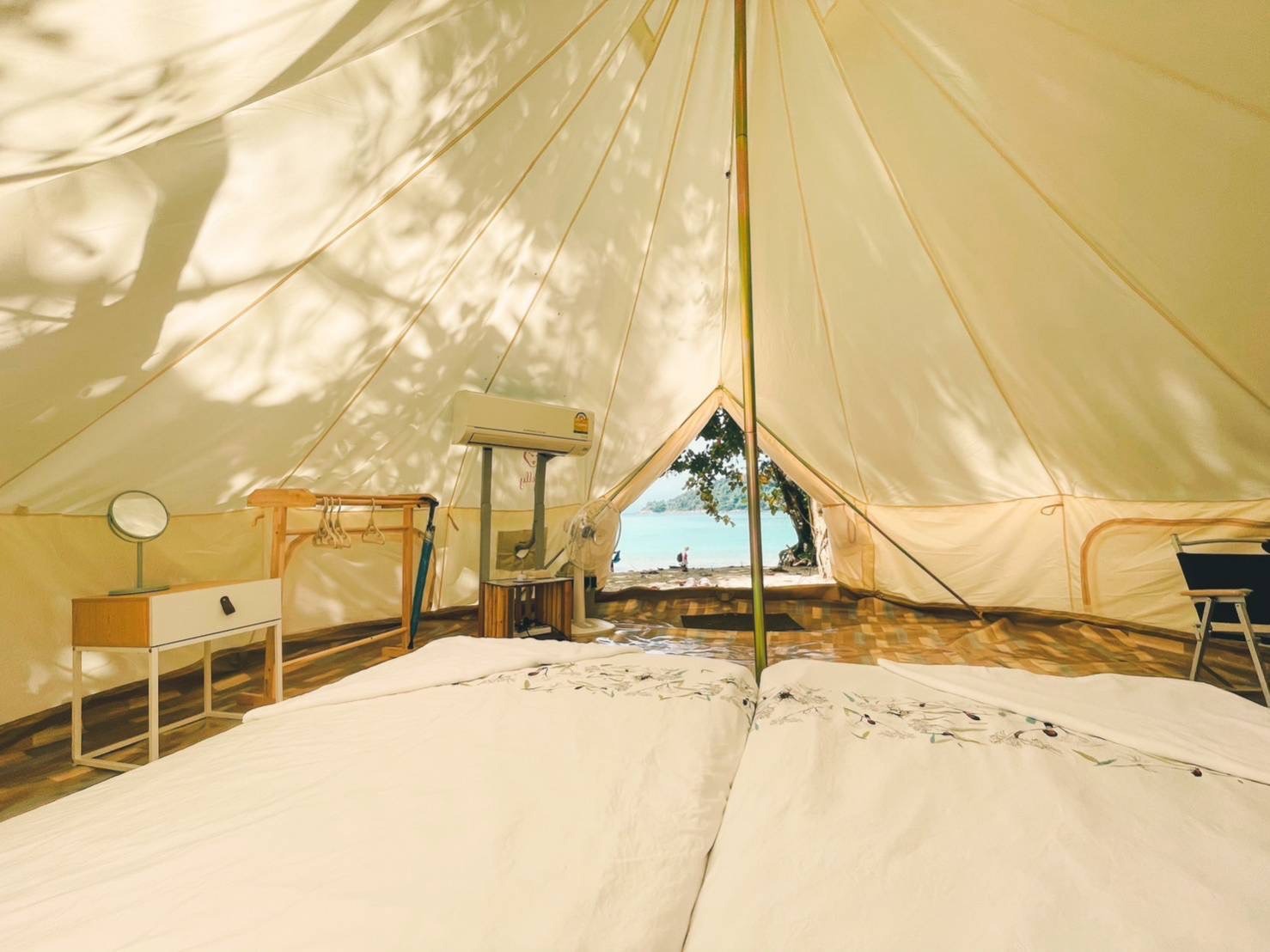 air conditioning and dressing table inside a mae ngam deluxe camping tent, surin islands